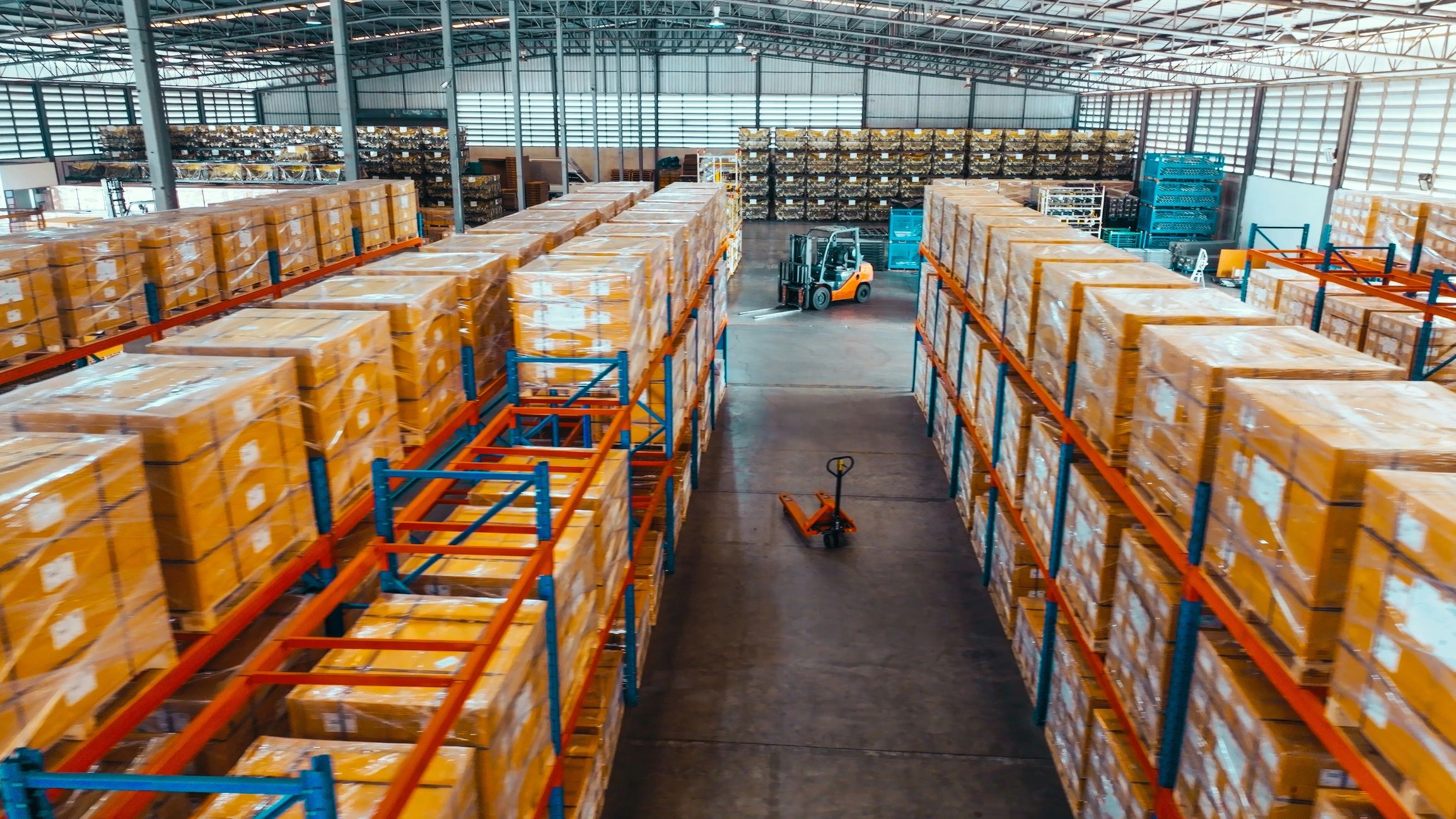 Warehouse shelves stocked with boxed automotive inventory